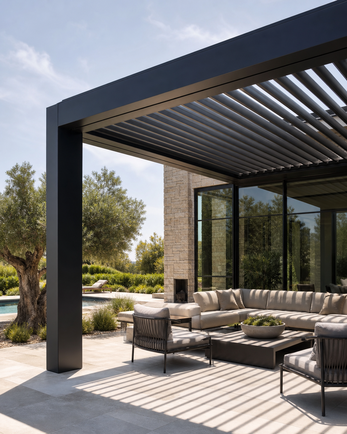 A precisely detailed louvered roof controlling sunlight above an outdoor room