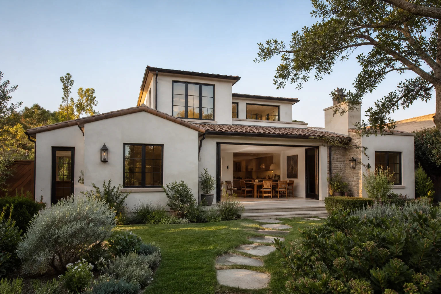 A set-back upper-level addition composed with the original California residence